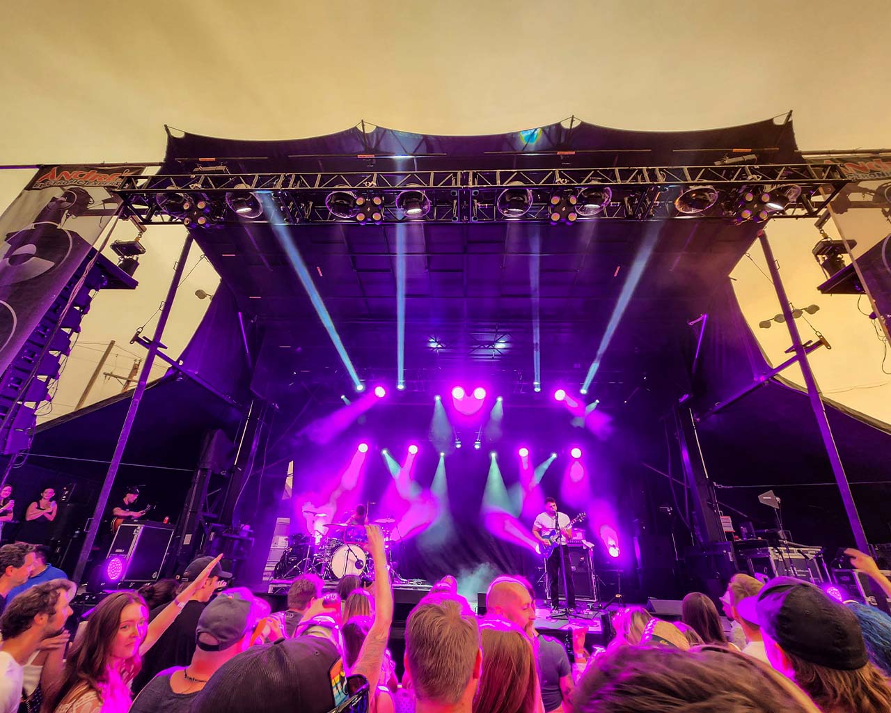 band plays on mobile stage
