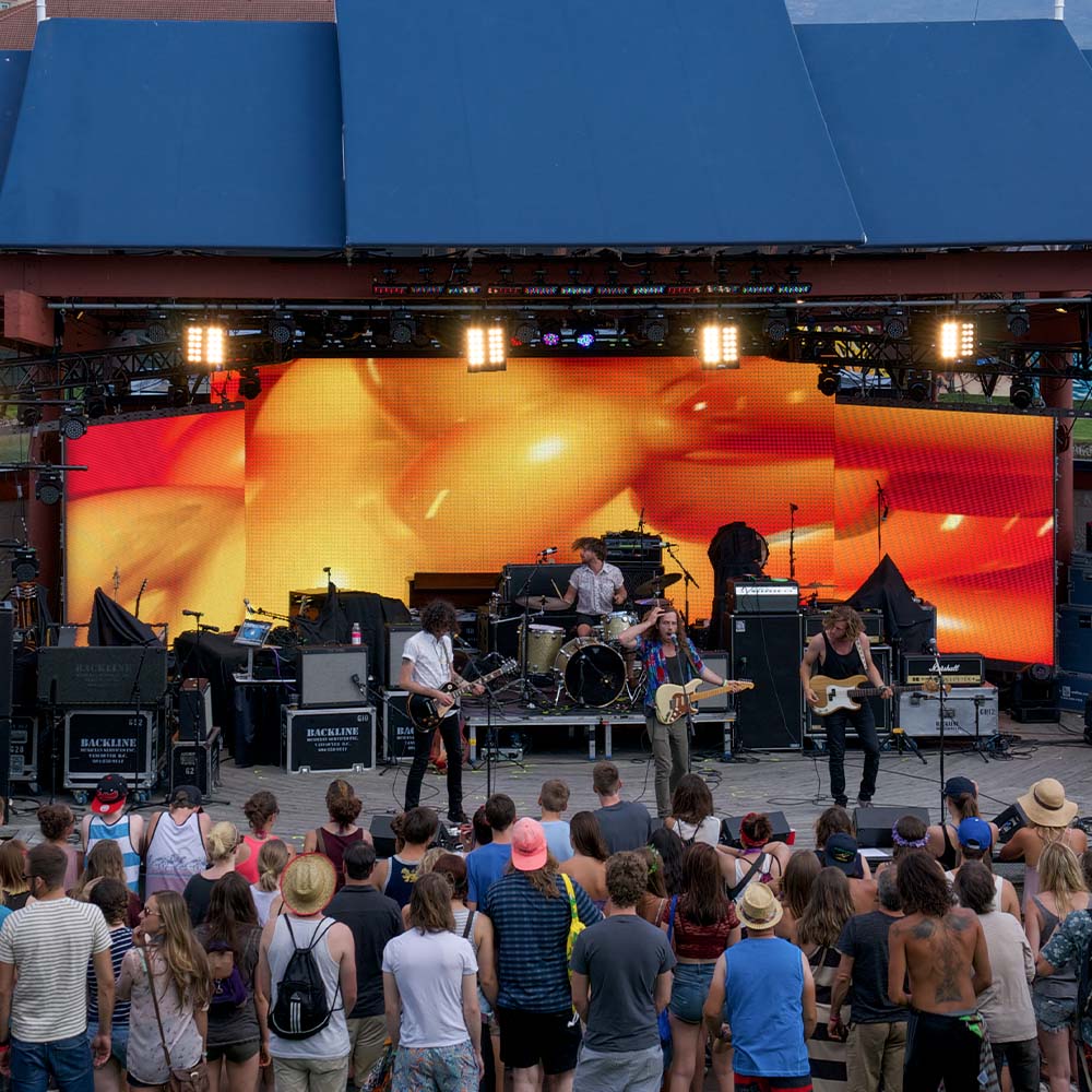 Band plays in front of large LED screen