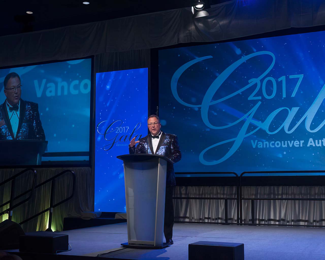 Speaker on stage at Vancouver Auto Show Gala